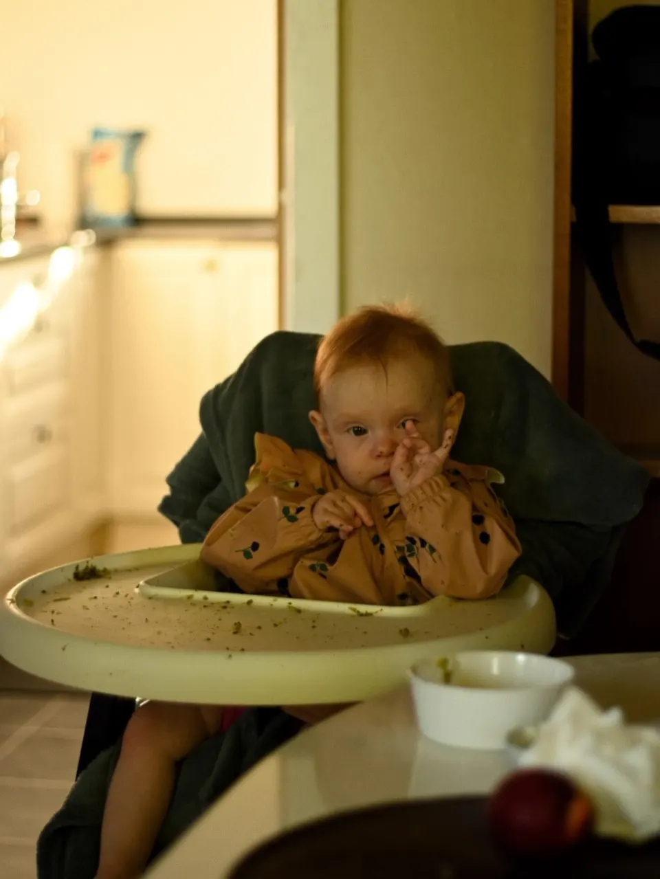Baby in high chair at home, a day-in-the-life family session