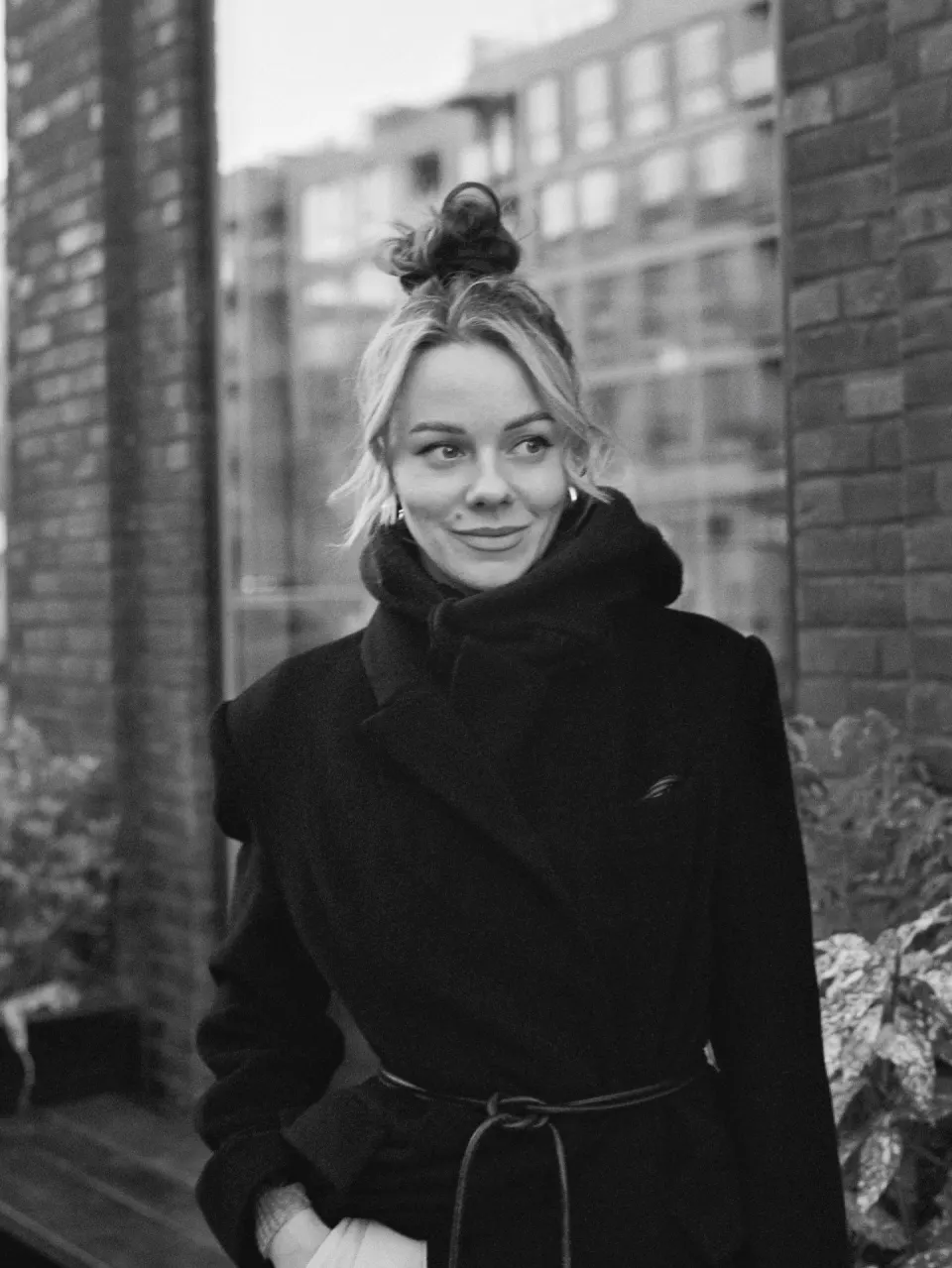 Black and white portrait of a smiling woman in Copenhagen