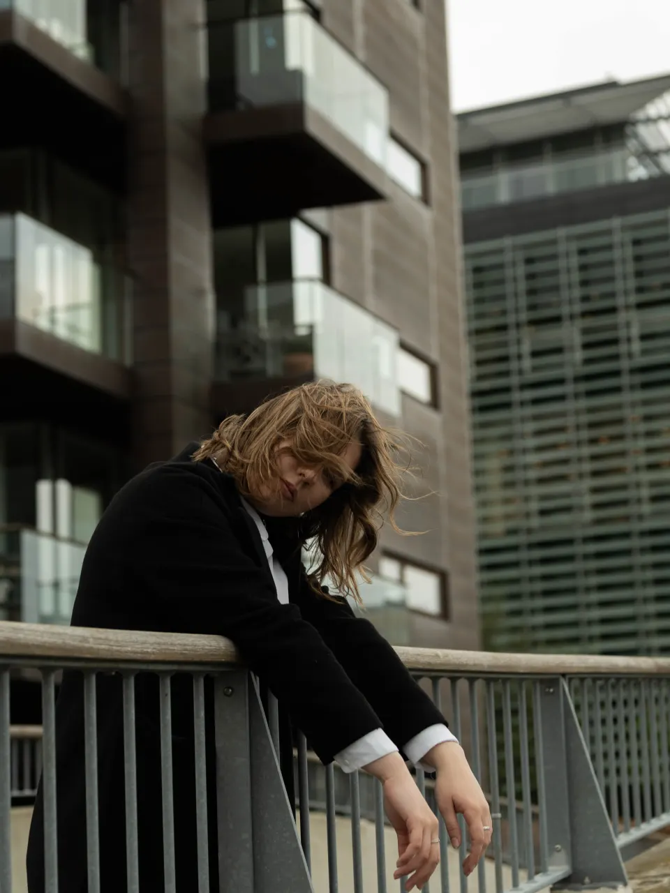 Moody urban portrait on a Copenhagen balcony