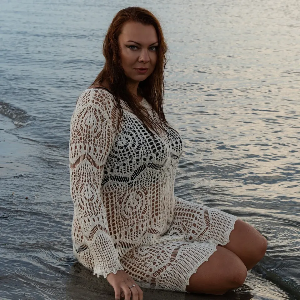 Golden hour portrait sitting in the water at a Copenhagen beach